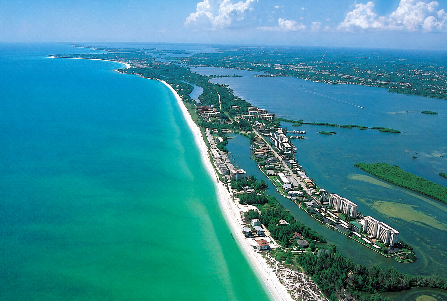 Aerial view of the Siesta Key coastline between the Gulf and bay