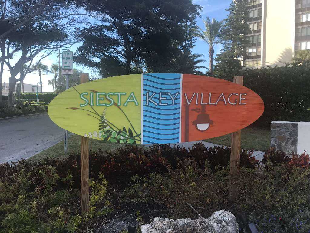 Colorful Siesta Key Village surfboard sign